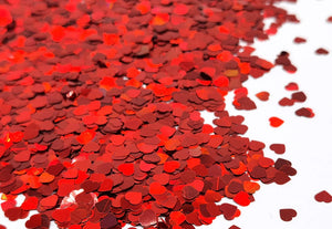 Red heart loose cosmetic glitter for face, nails, hair, and body.